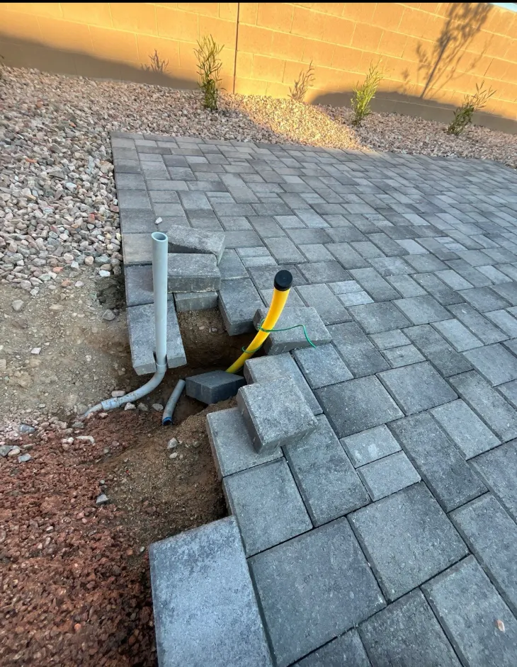 Yard line access through paver patio
